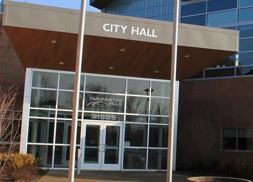 The image shows the entrance to Farmington Hills City Hall in Michigan