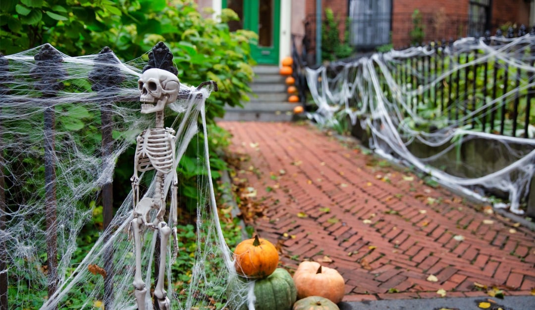 A home decorated with a Halloween theme, featuring spooky decorations and a festive front look.