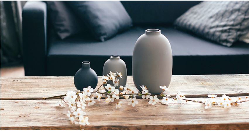 Three simple, elegant vases in a minimalist home decor setting