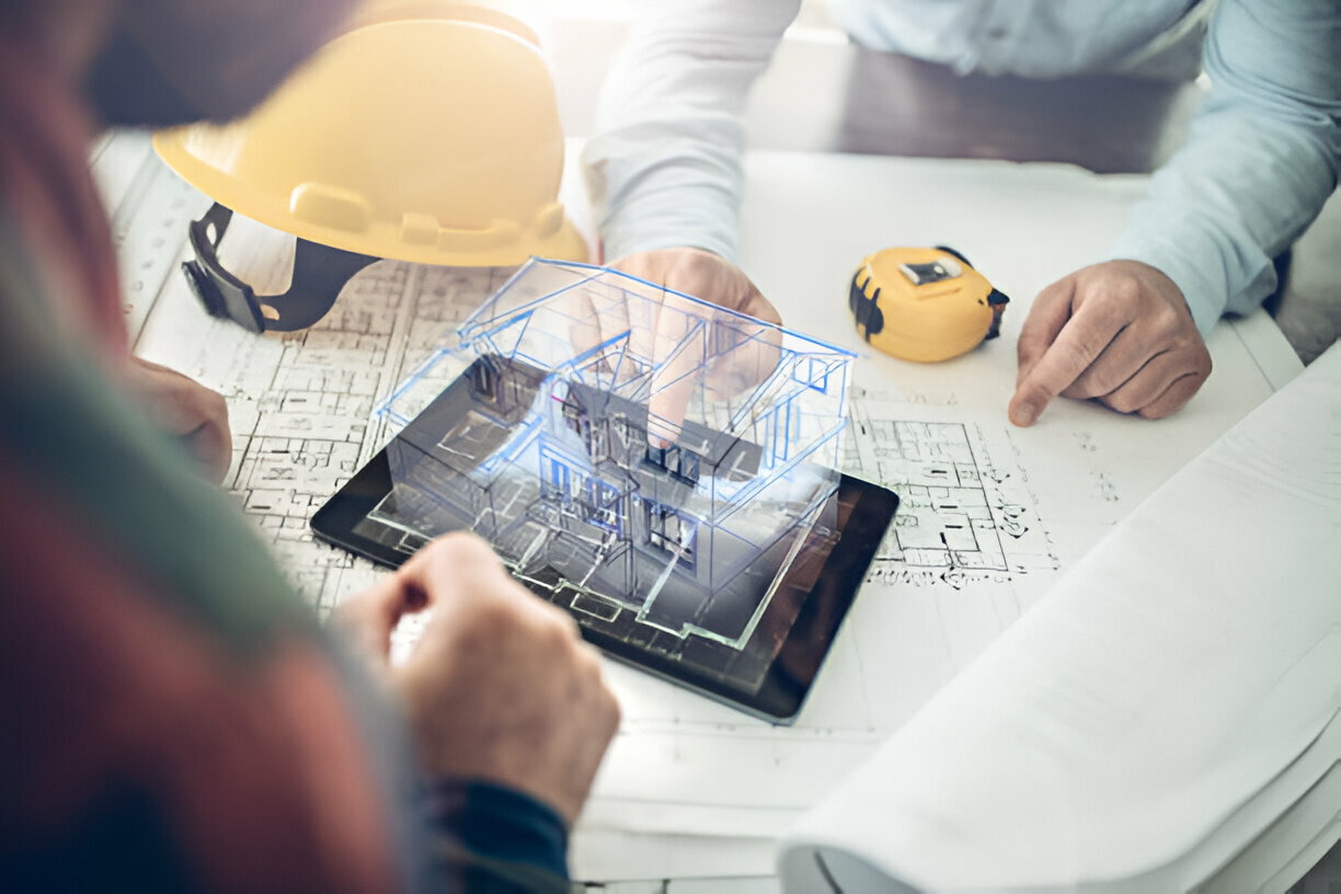 3D architectural plan displayed on a chart with two people engaged in discussion beside it