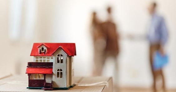 Miniature model of a house displayed on a desk