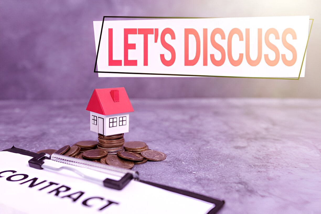 The image shows: Text: "LET'S DISCUSS" at the top. A house model: Sitting on a stack of coins. A clipboard: With the word "CONTRACT" visible on a paper