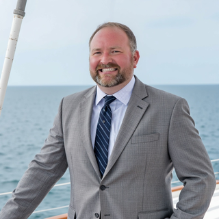 Troy_Headshot_Grey Suit on Boat