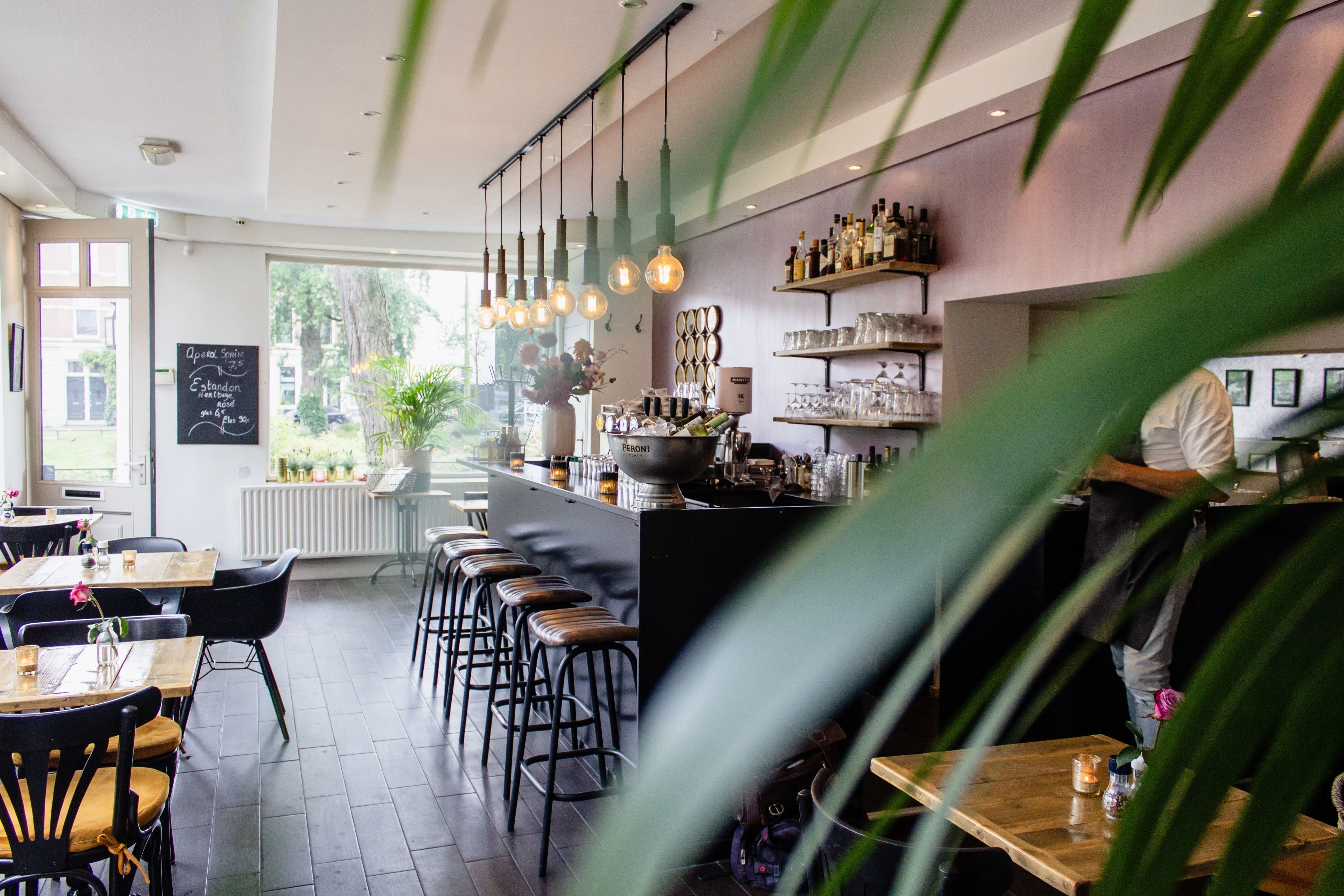 interior-shot-cafe-with-chairs-near-bar-with-wooden-tables (1)