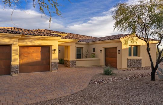 Paver Driveway and Rustic Steel Patina Garage Doors