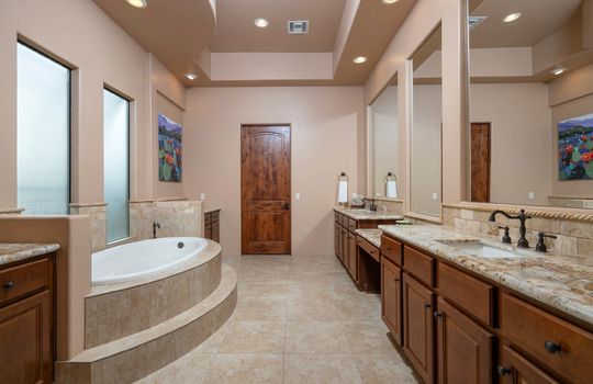 Primary Bath With Soaking Tub and Dual Vanities