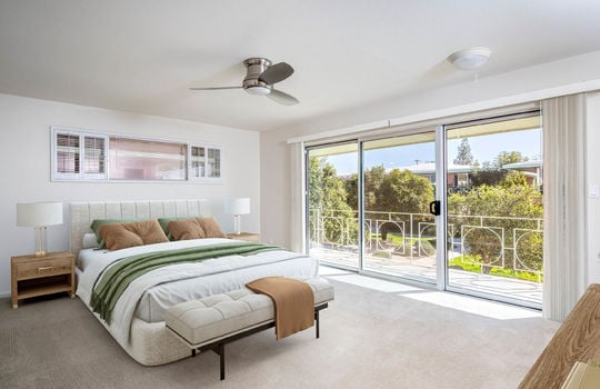 Primary Bedroom With Balcony (Staged)