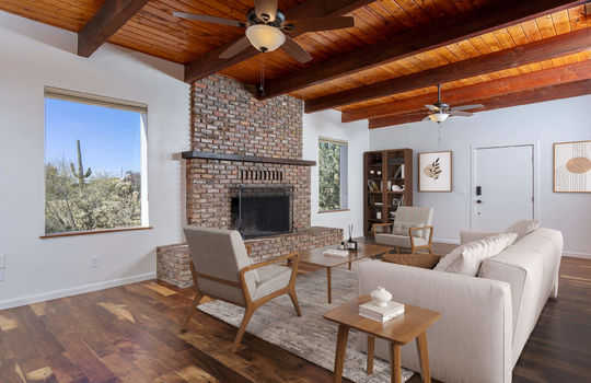 Living Space With Fireplace and Desert Vistas - Digitally Staged
