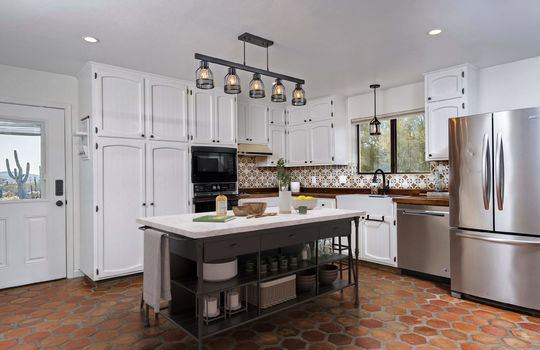 New Lighting ,Talavera Tile Backsplash, Farmhouse Sink - Digitally Staged
