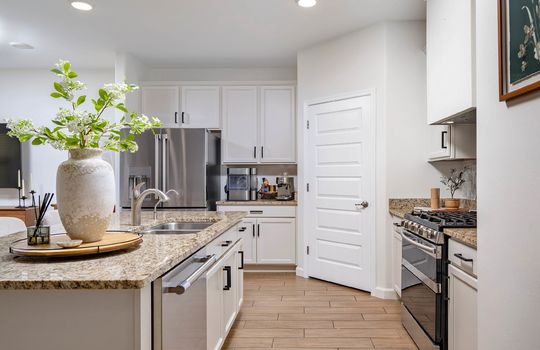 Open Kitchen With Granite Counters and All Appliances
