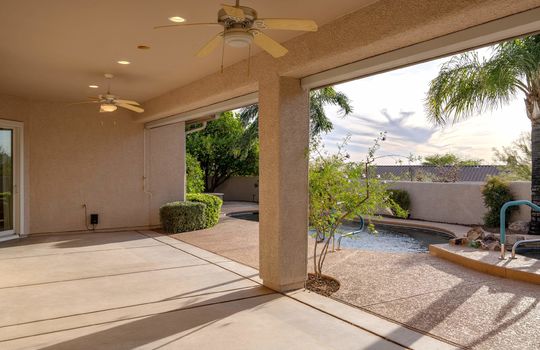 Covered Patio With Ceiling Fans, Electric Rolling Sun Shades and Lights