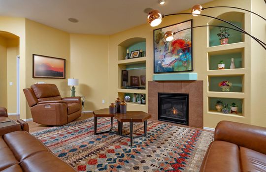 Open living space has leather sectional reclining sofa set