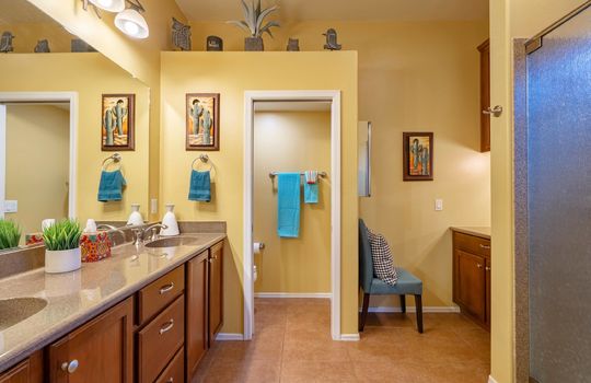 Primary bath has dual sinks and a walk-in shower