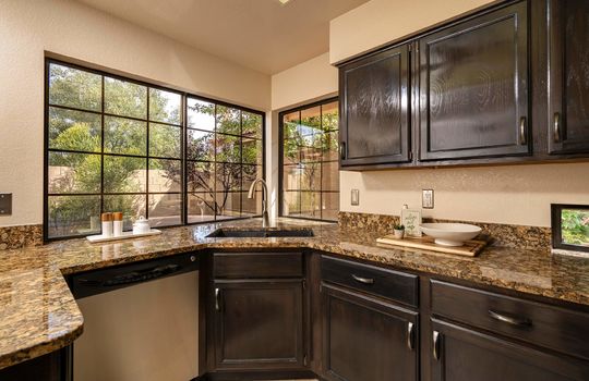 Granite Counters and Undermount Sink With View Of Outdoor Space