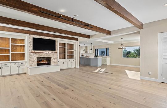 Great Room With Beamed Ceilings and Gas Fireplace