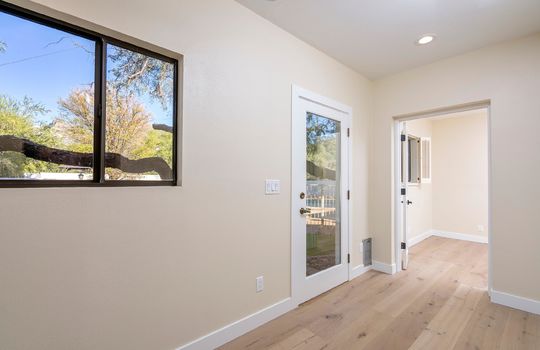 Hall To Third Guest Bedroom Has Pantry Closet & Outdoor Access