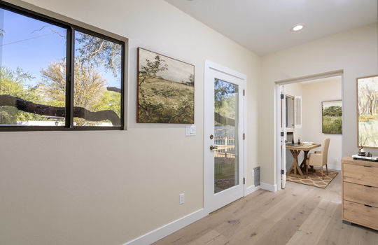 Hall To Third Guest Bedroom Has Pantry Closet Outdoor Access- Digitally Staged