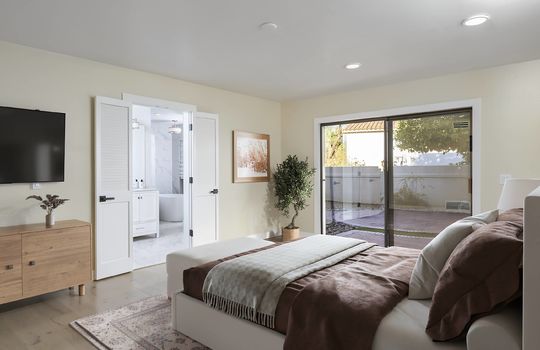 Primary Bedroom Suite With Access To Patio- Digitally Staged