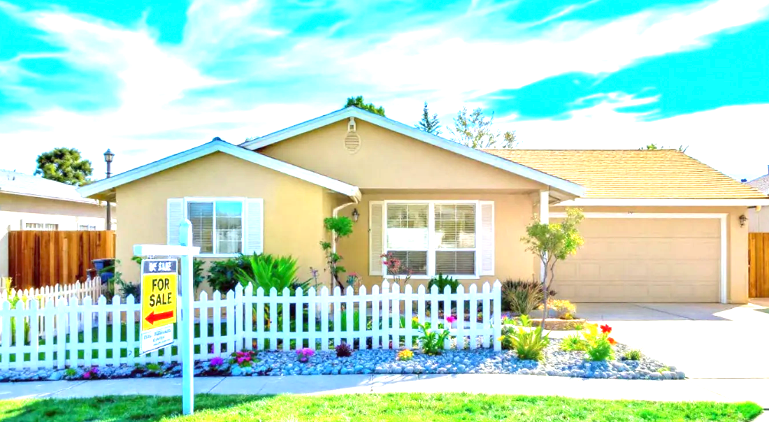 Suburban house with for-sale sign