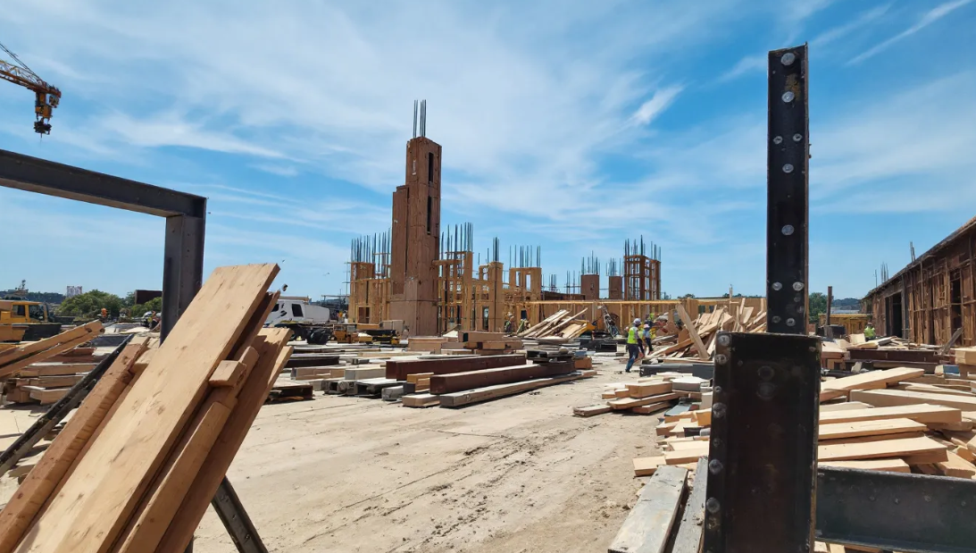 Construction site with lumber and steel beams