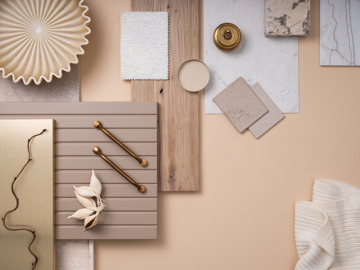 Classic flat lay composition in beige and gray color palette with textile and paint samples, panels and tiles. Architect and interior designer moodboard. Top view. Copy space.