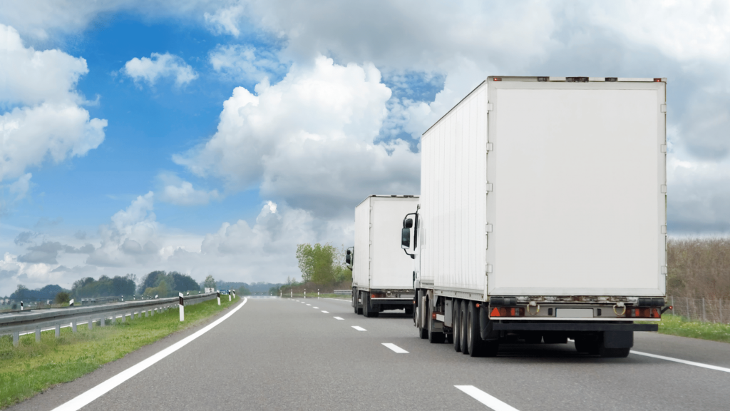 California Exodus Blog - Moving trucks going down the highway