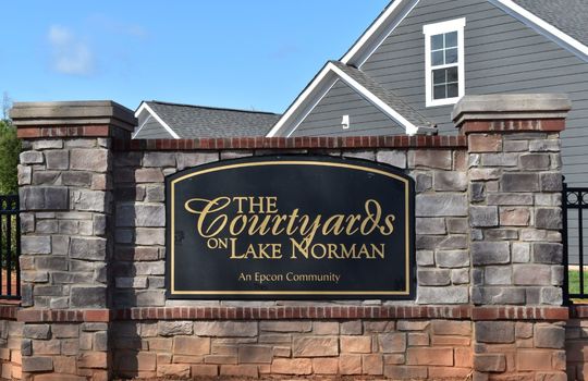 View of the entrance sign for The Courtyards On Lake Norman