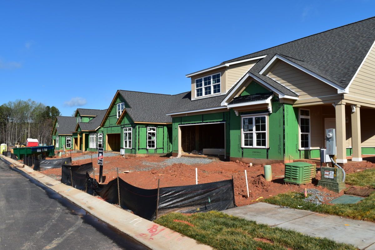 View from the street of homes under construction in The Courtyards On Lake Norman