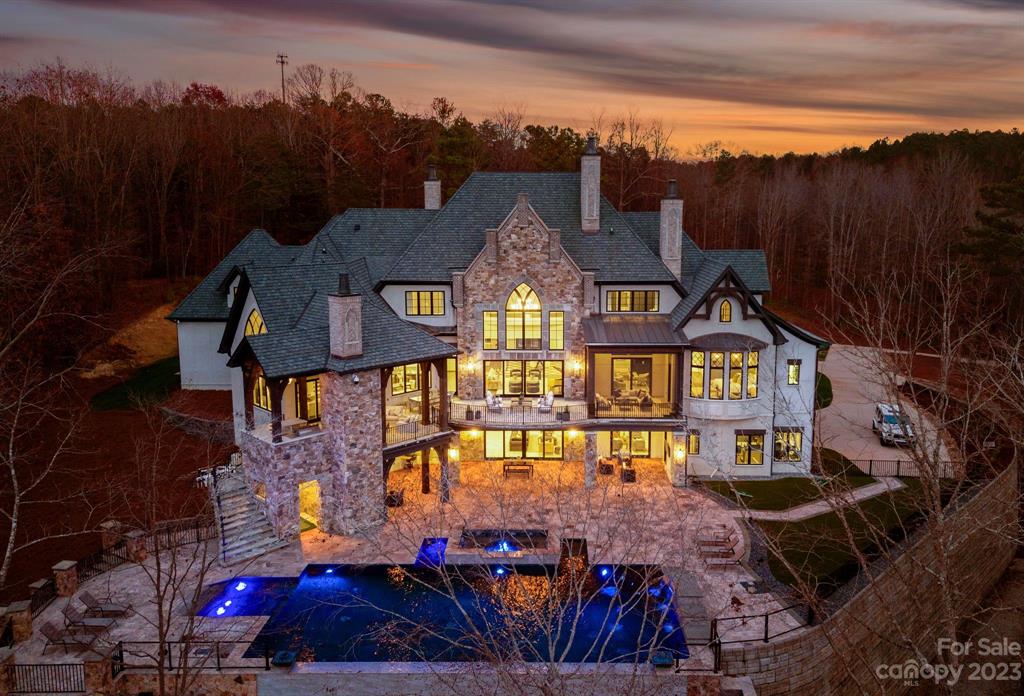 View of the back of Christian McCaffreys Lake Norman Home - Grand Lac Chateau