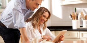 Couple Researching Ideal Homebuyer on Tablet
