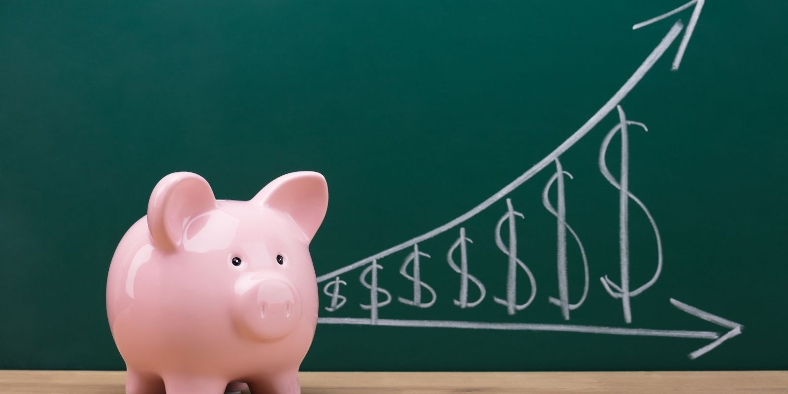 Piggy bank in front of chalk board showing the affordability of Fort Worth