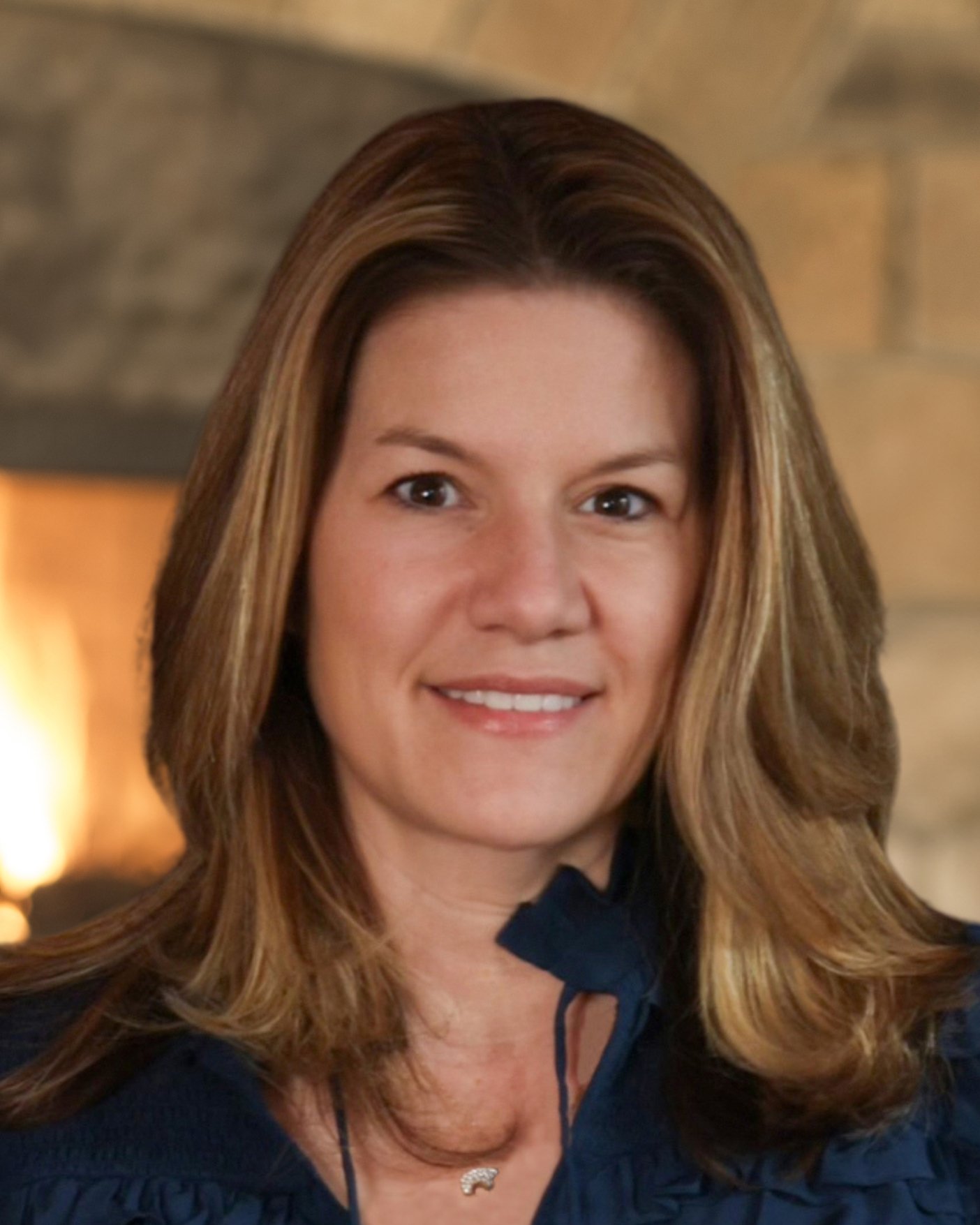 2024 malia headshot with fireplace final