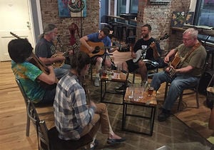A group of people having a traditional Appalachian North Carolina folk jam session.