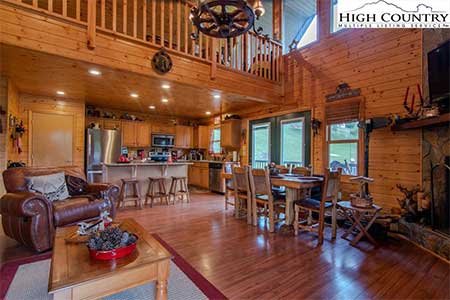 Living area inside 217 New River Landing log cabin in Crumpler, NC