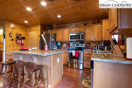 Log cabin kitchen inside 271 New River Landing log cabin in Crumpler, NC