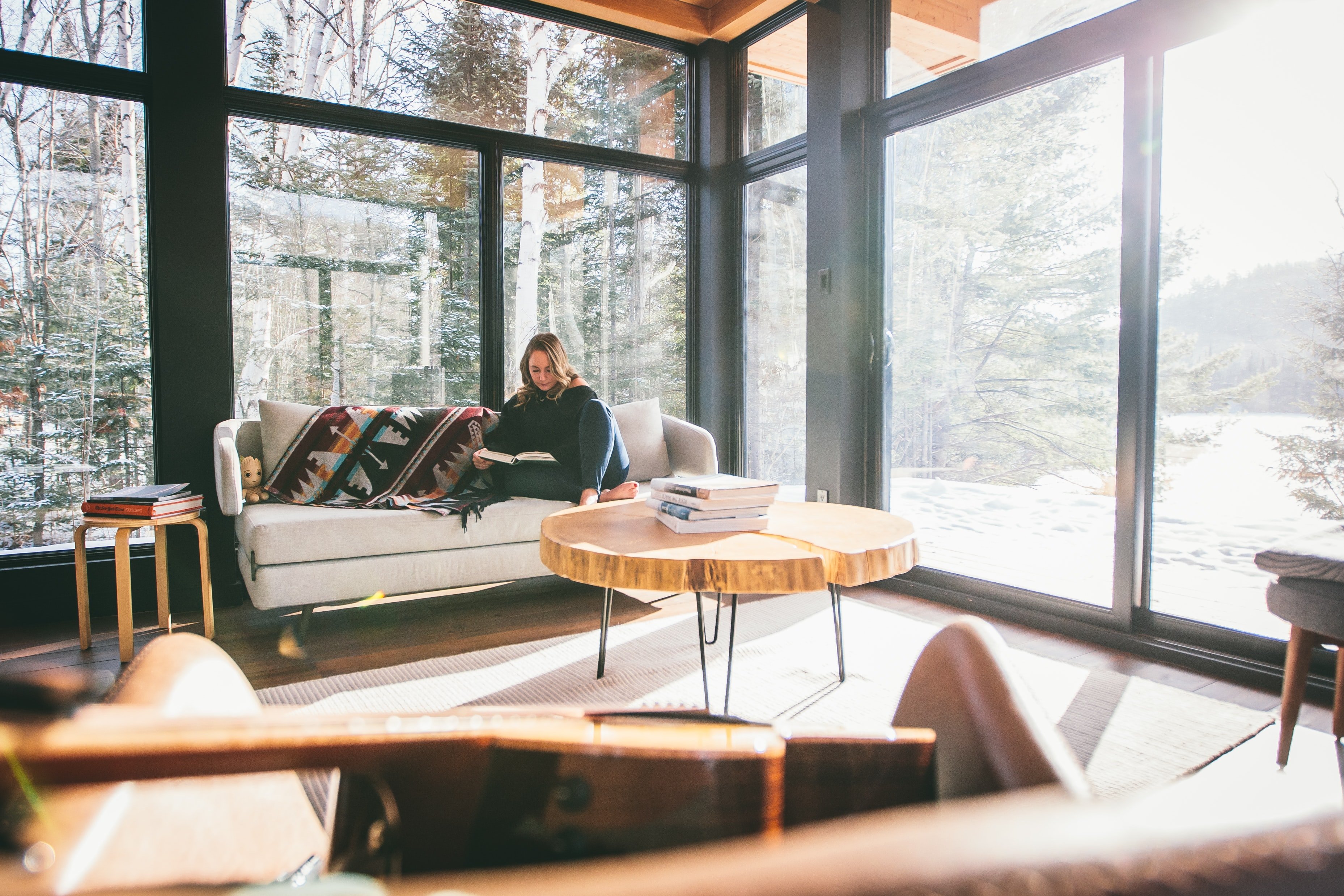Lady relax in a High Country Luxury home with mountain views and rustic furniture