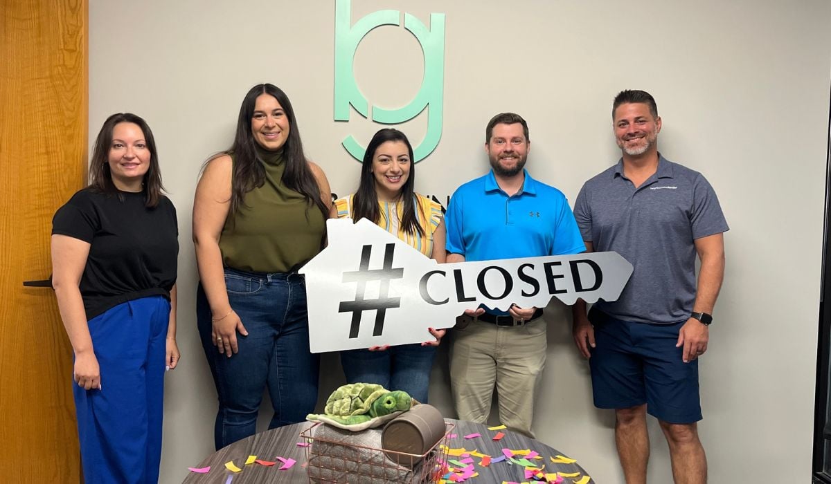 Megan Otte celebrating with happy buyers Sandy and Britton in Fort Mill, SC