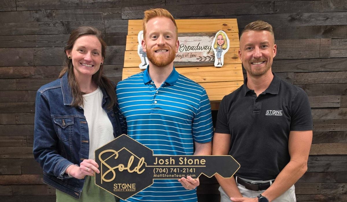 Sam and Shelby celebrating the successful sale of their Belmont NC home with Stone Realty Group in the Charlotte area