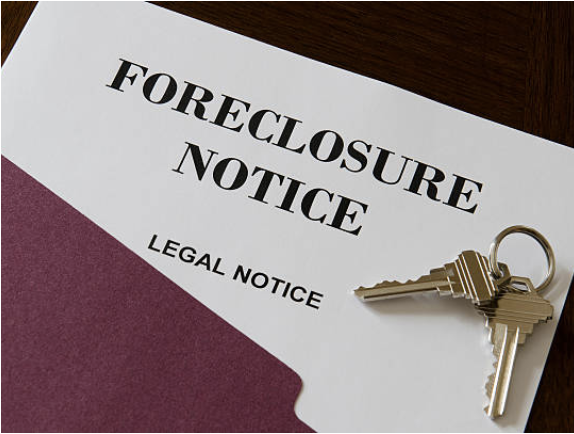 Foreclosure Notice. Legal Notice. with a pair of keys laying on top