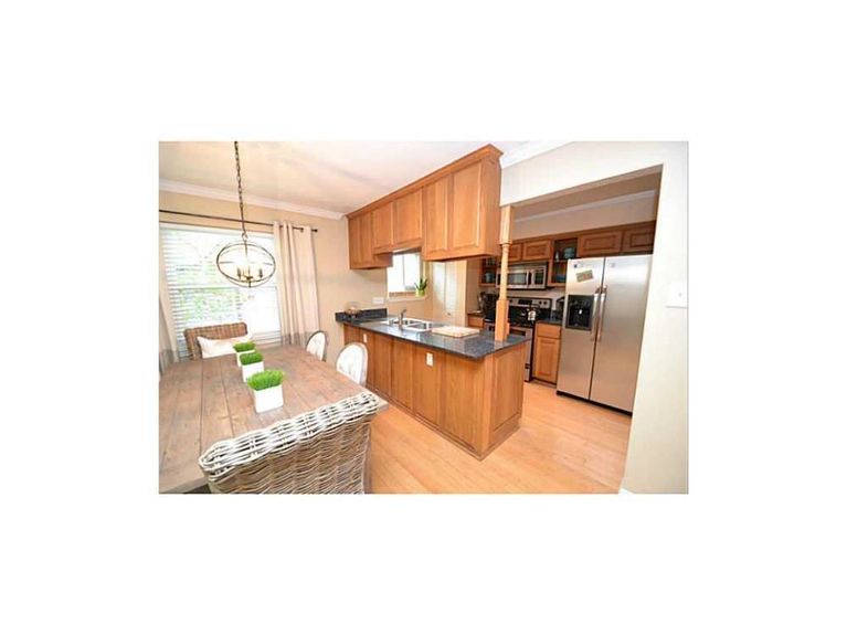 Plenty of storage in the open kitchen/dining area.  Granite coun