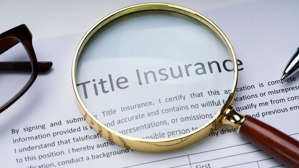A magnifying glass focus on title insurance documents