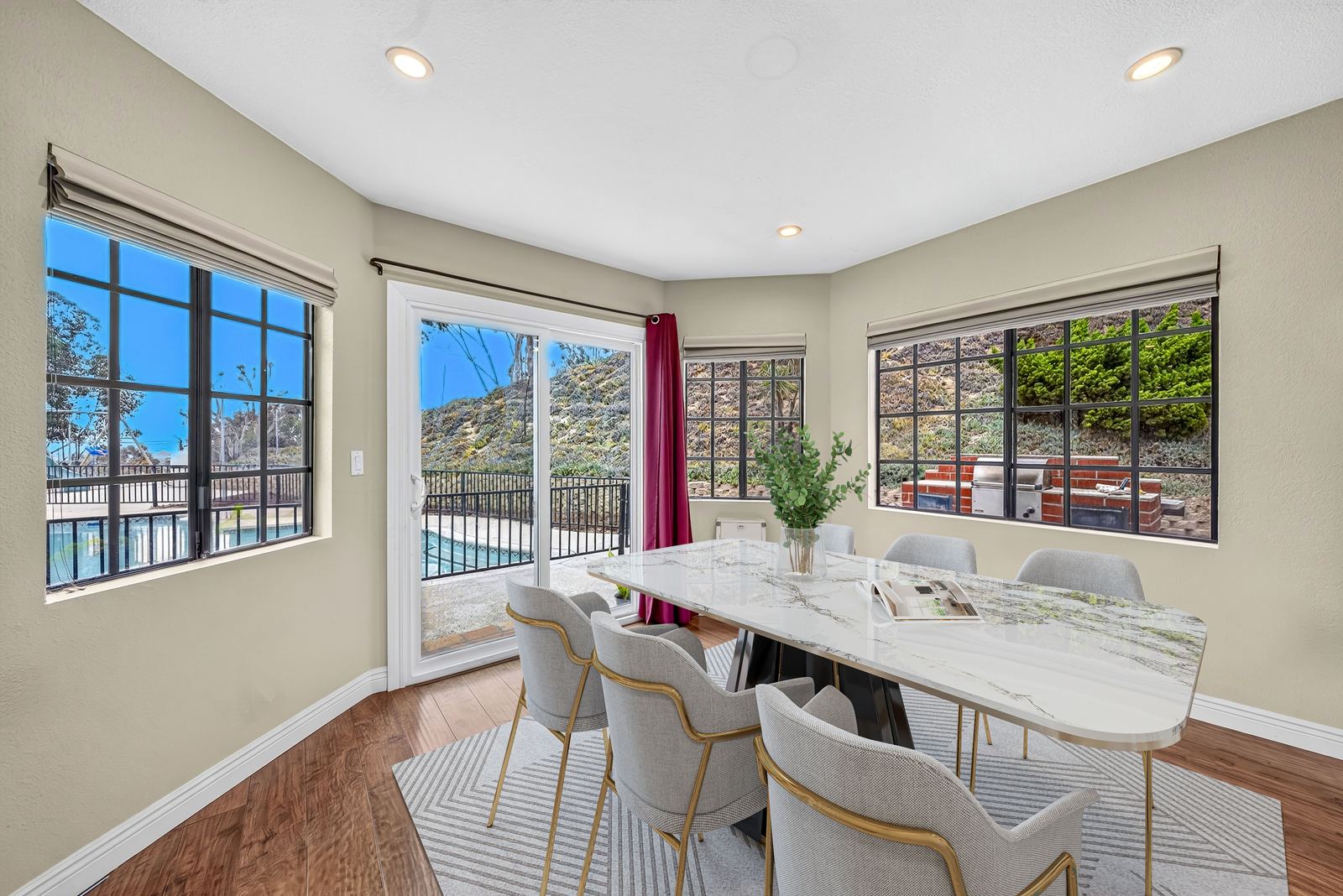 Dining room with a sliding door out to the pool