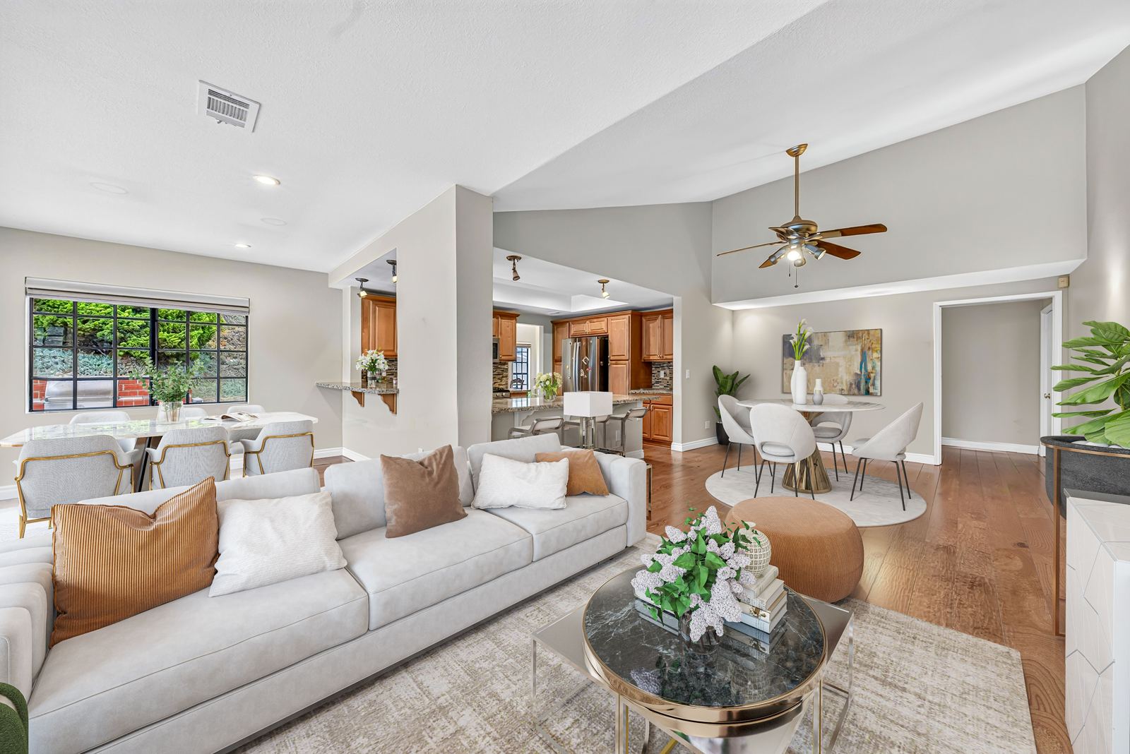 Open living room flowing into the kitchen and dining area