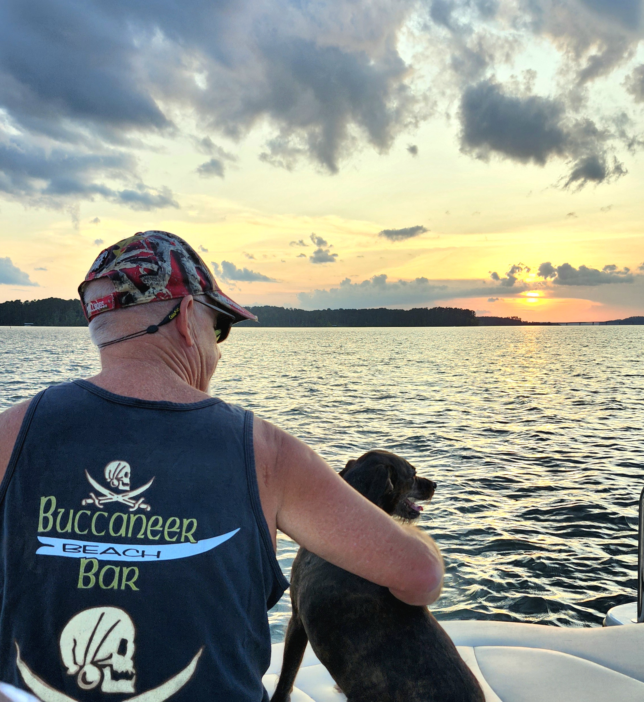 Evening light on the back of a boat at Lake Thurmond with calm water and sunset sky