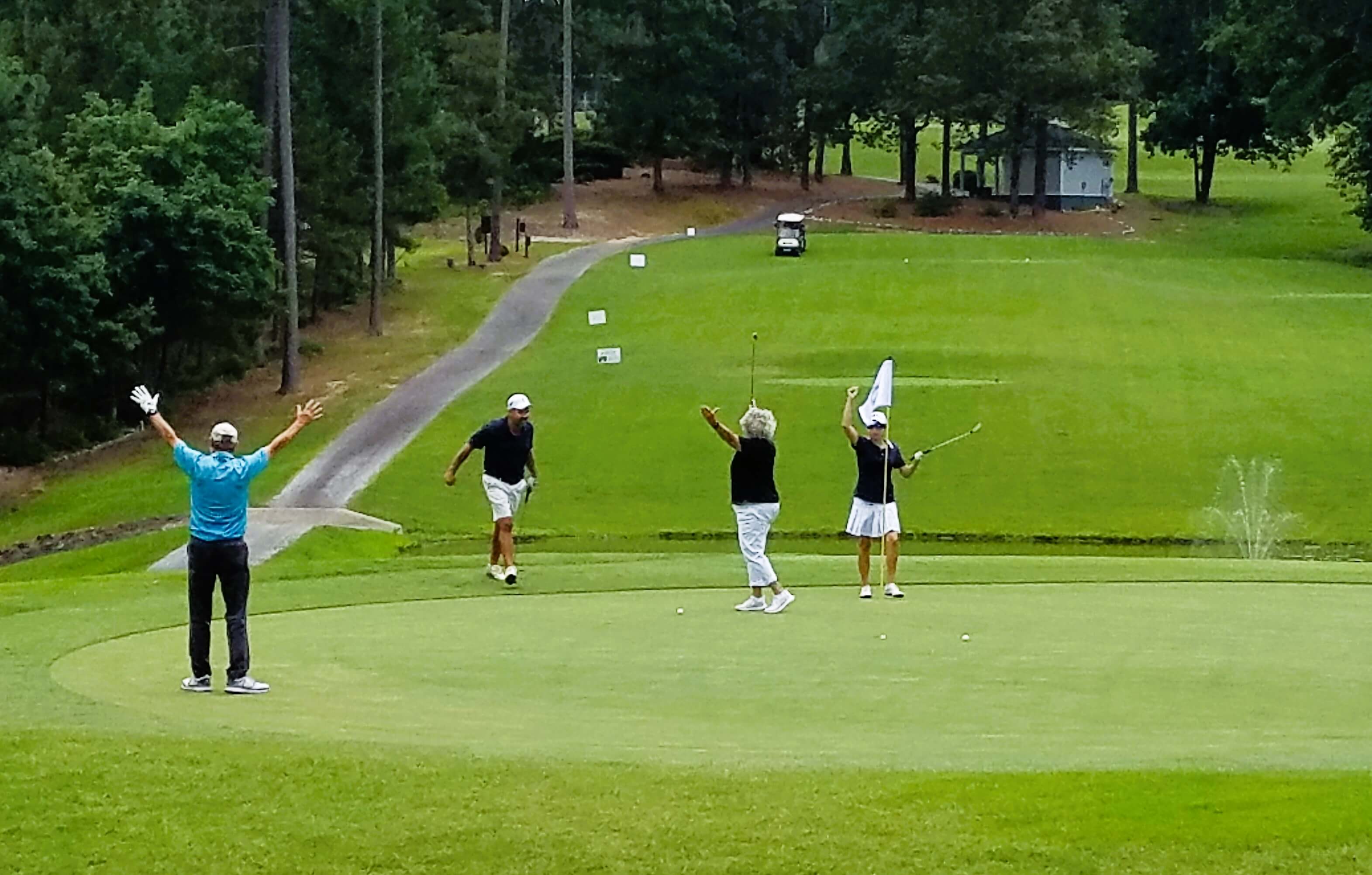 Golfers enjoying an evening round at Savannah Lakes Village golf course