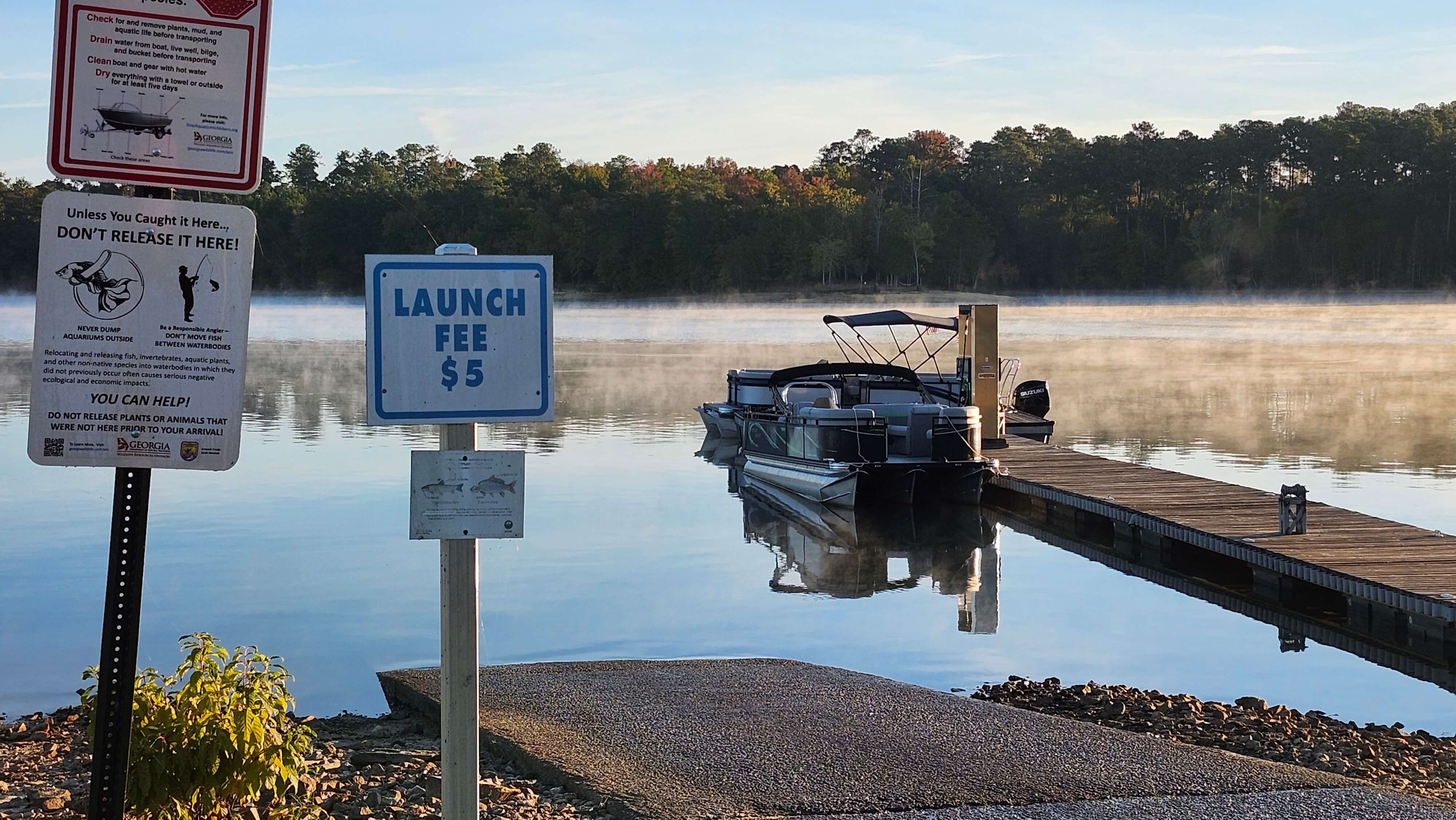 Fuel docks and slips at Soap Creek Marina with clear wayfinding signs