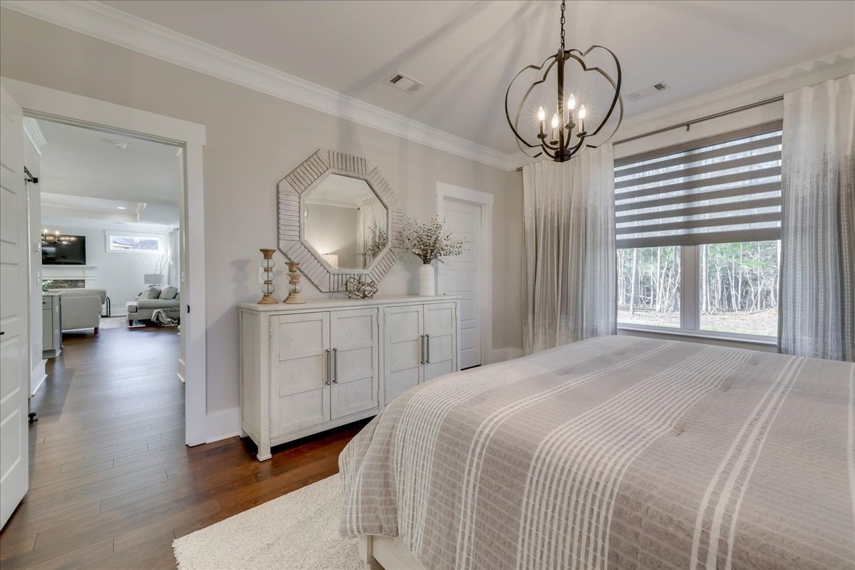 Accessible primary suite with wide doorway and step-in shower.