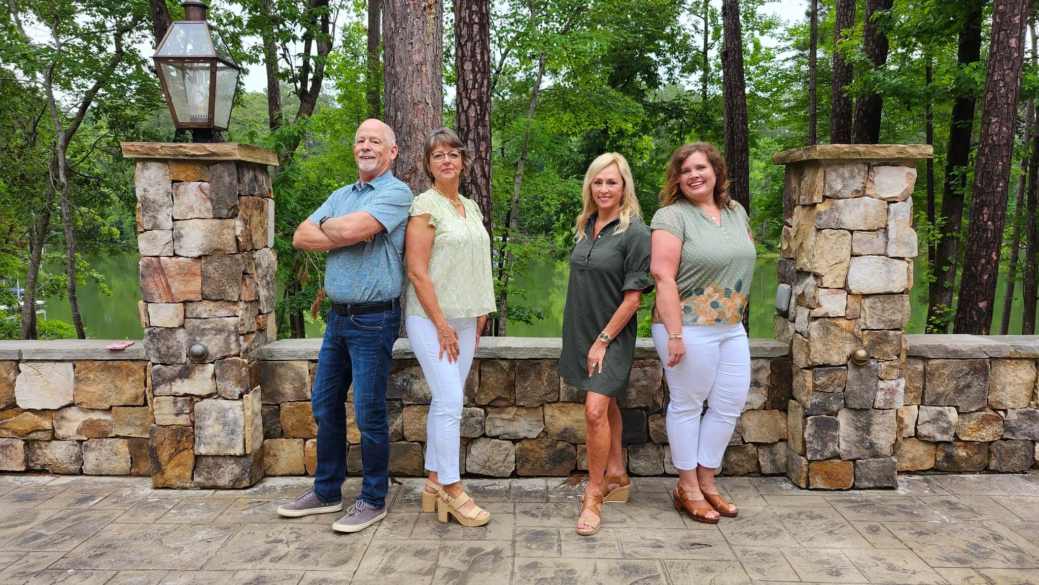 Greene Advantage Real Estate team standing in front of a lakefront home in Savannah Lakes Village
