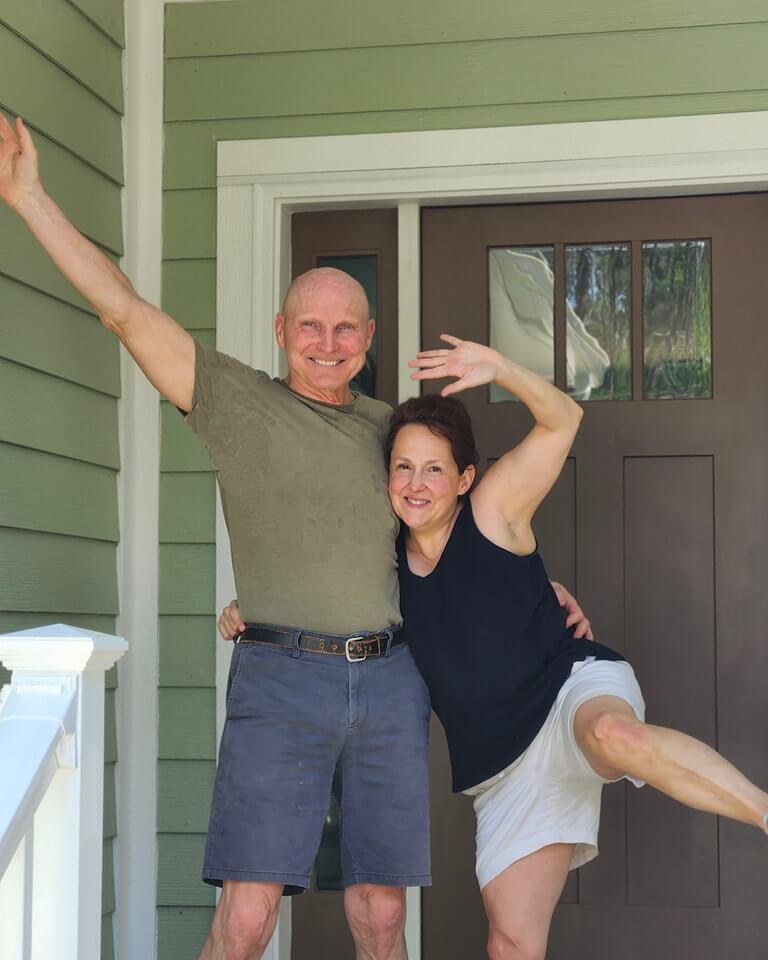 Happy couple celebrating on the porch of their new home in Savannah Lakes Village