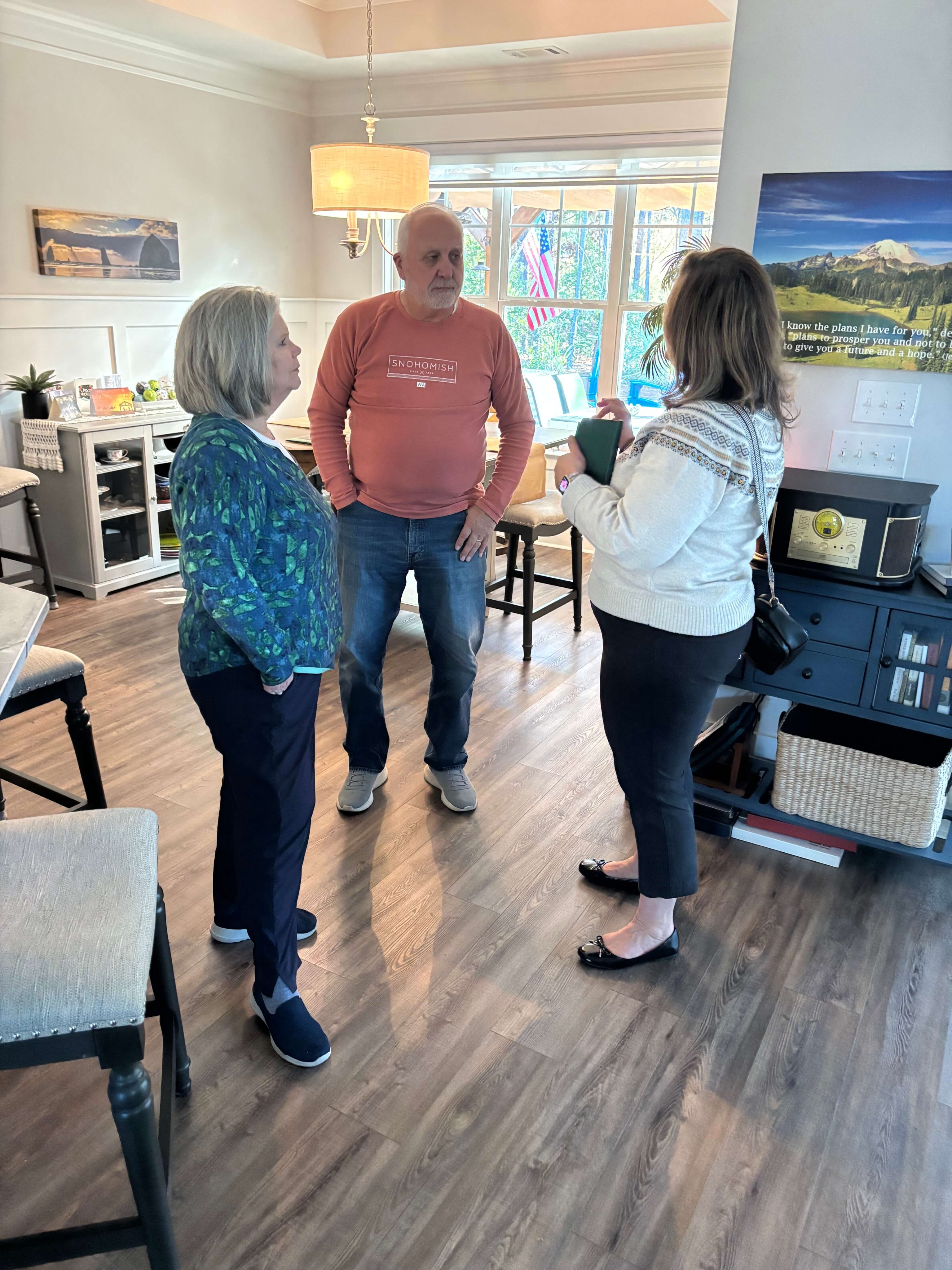 Couple touring a lakefront home in Savannah Lakes Village